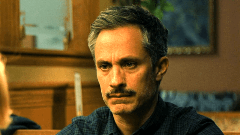 Gael García Bernal as Dave Delgado sitting at a table in Holland